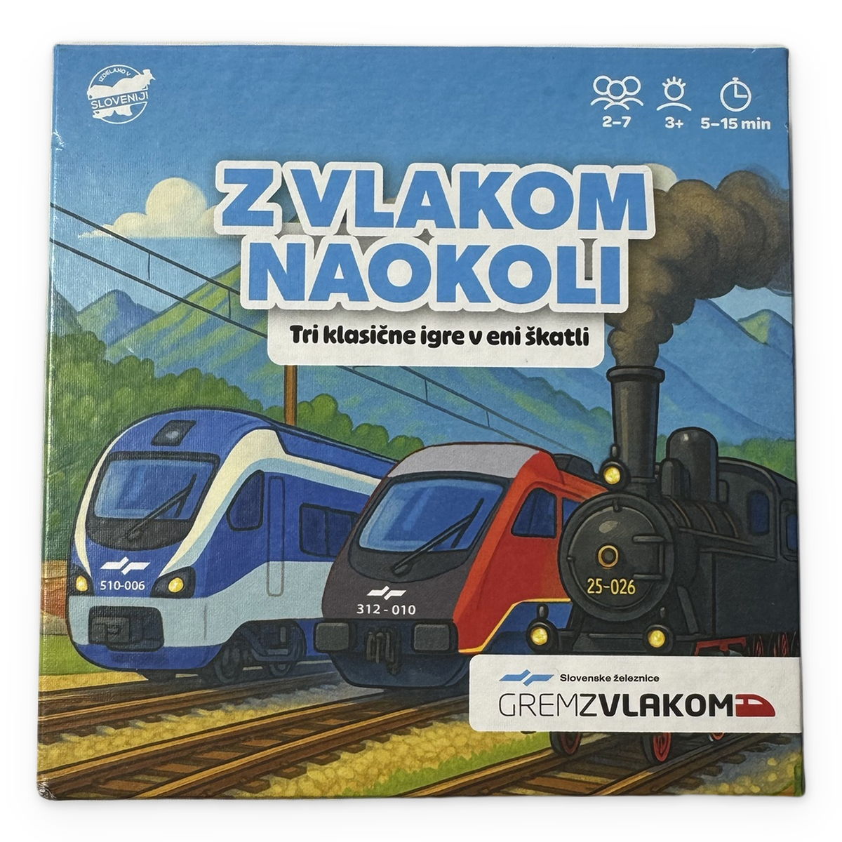 Z vlakom naokoli – pokrov škatle s slovenskimi vlaki